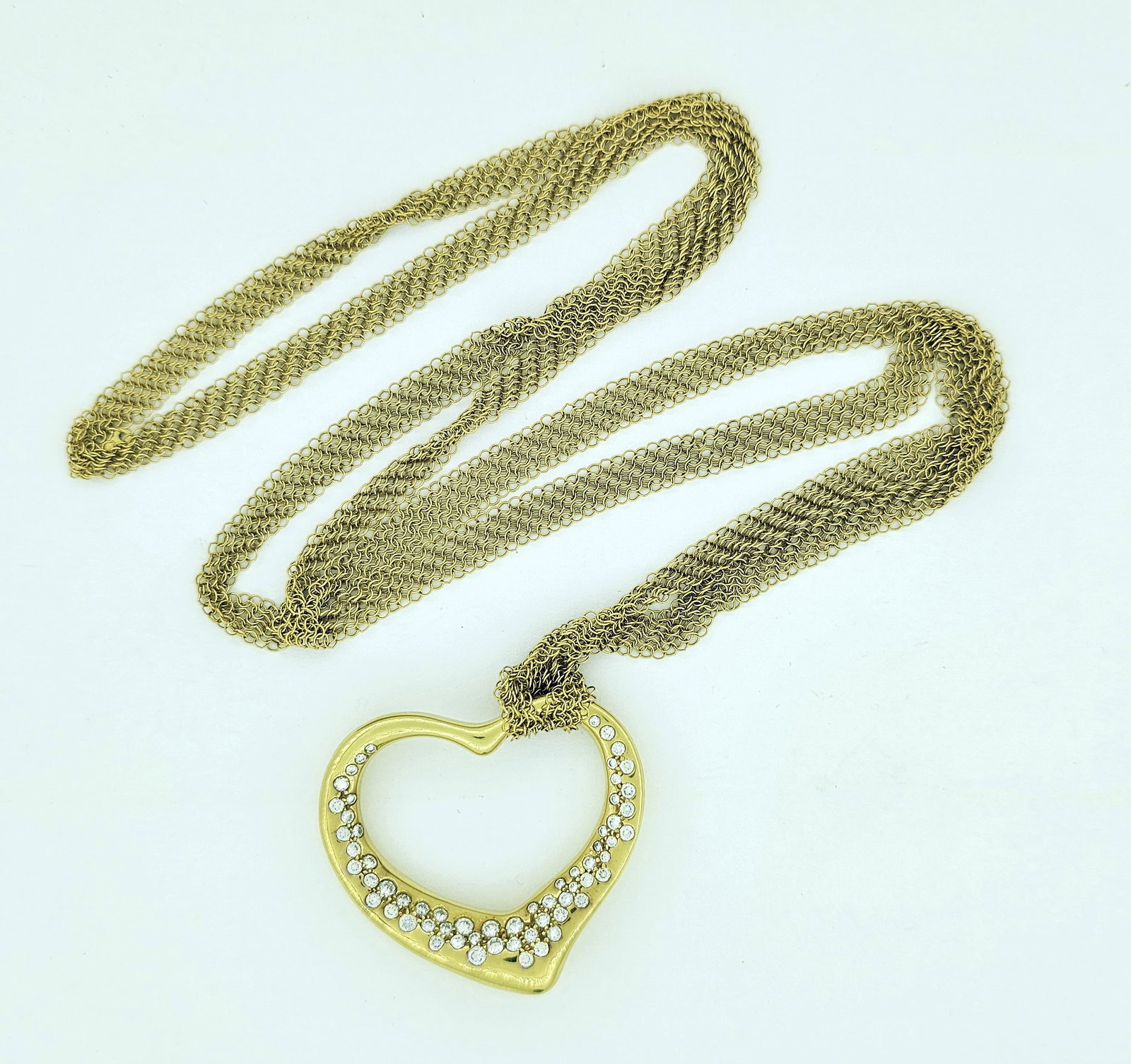 Tiffany & Co. 18K Gold Peretti "Heart" Pendant: Tiffany & Co. 18K Gold Peretti "Heart" Pendant and Necklace. Marked "Peretti 750" and "Tiffany & Co" verso and on necklace. Metal: 18k Yellow Gold Approx Diamont Weight: .92 TCW Necklace Length: 30