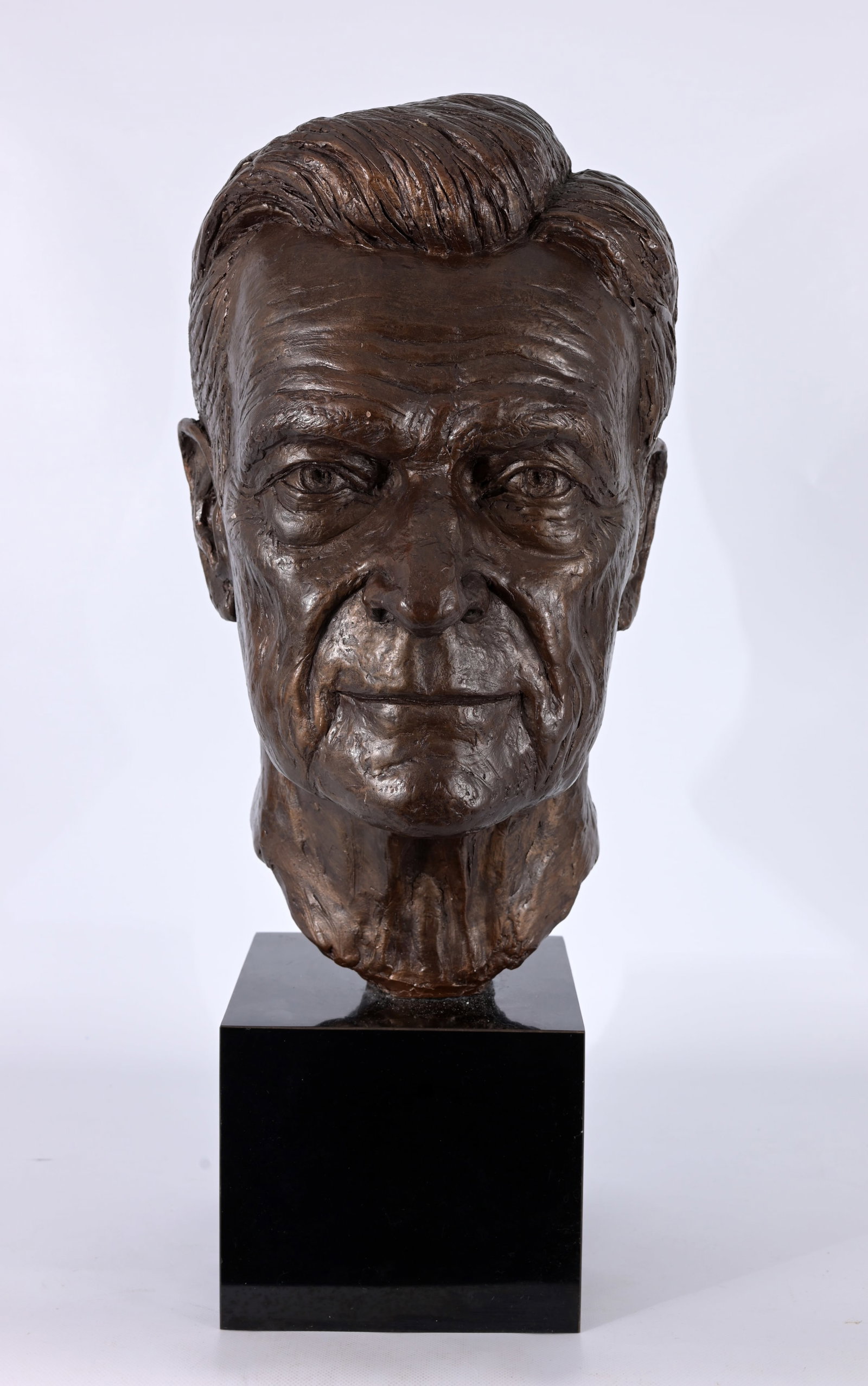 Marc Richard Mellon (New York, b. 1951): Marc Richard Mellon (New York, b. 1951) "John Silber" - 2002 Painted Plaster on Marble Base. Signed and dated on back of neck. Bust Dimensions: 17.5 x 9.25 x 11 in. Overall Dimensions: 24 x 9.25 x 11