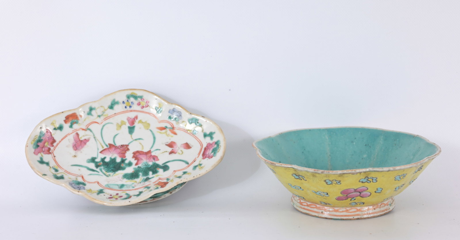 (2) Antique Chinese Famille Rose Porcelain Pieces: (2) Antique Chinese Famille Rose Porcelain Pieces. L: Footed Lozenge Serving Dish R: Scalloped Yellow-Ground Bowl Dimensions (L-R): 1.75 x 7.25 / 2.25 x 6.5 in.