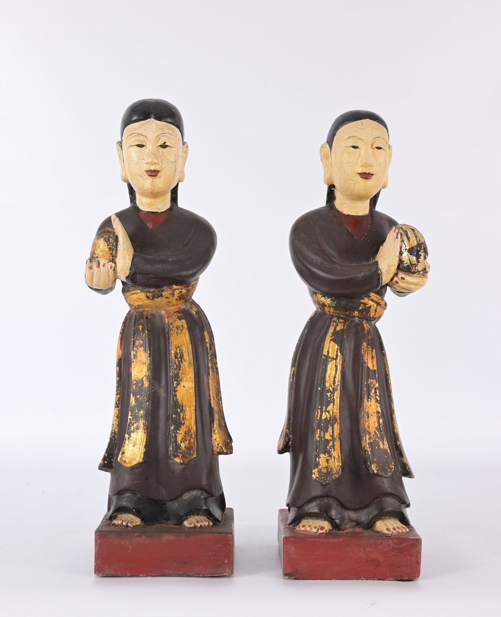 Pair of Vietnamese lacquered wood sculptures: Pair of Vietnamese lacquered wood sculptures Label on the bottom indicates that they were legally permitted for export from Vietnam. The paper seals show that the items were officially inspected, appr