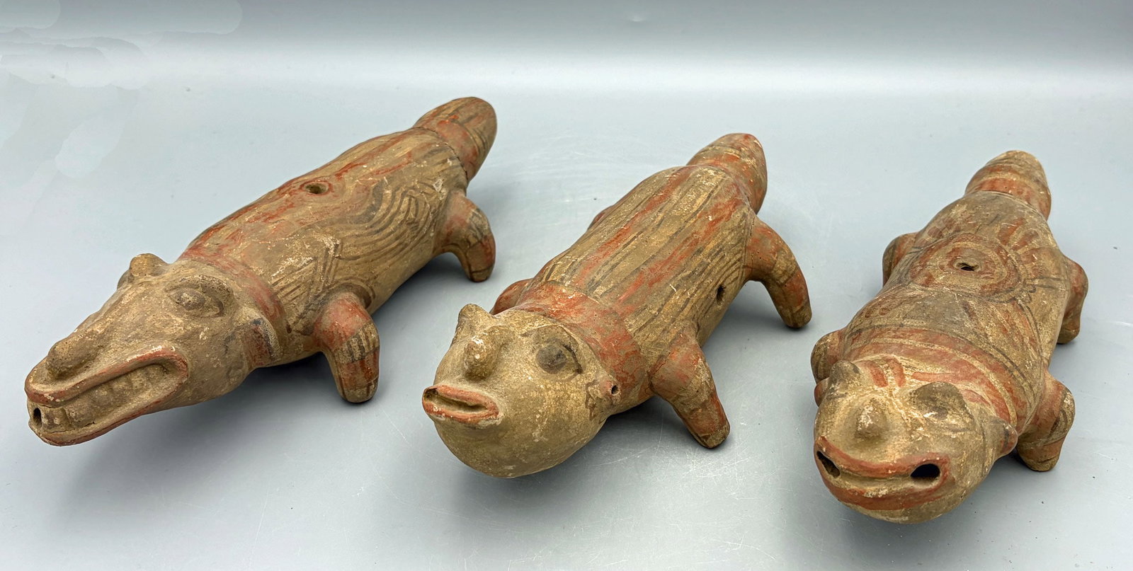 (3) Pre-Columbian Nicarao-Nicoya Effigies: A trio of rare Pre-Columbian Nicarao-Nicoya crocodilian effigies from Ometepe Island in Lake Nicaragua, ca. 800-1200 AD. They range from 8-1/2 in. to 9-3/4 in. in length, show good mineral deposits