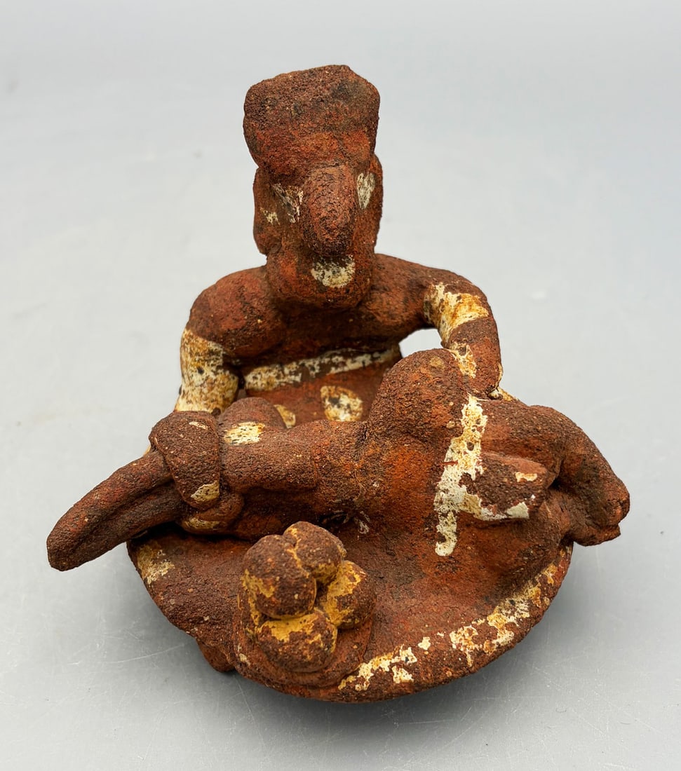 Nayarit platform scene from West Mexico: An excellent Nayarit platform scene from West Mexico, ca. 350 BC - 300 AD. It is 3-3/4 in wide and depicts a curandera (healer) treating a prone male. She is wearing a belted skirt and is adorned