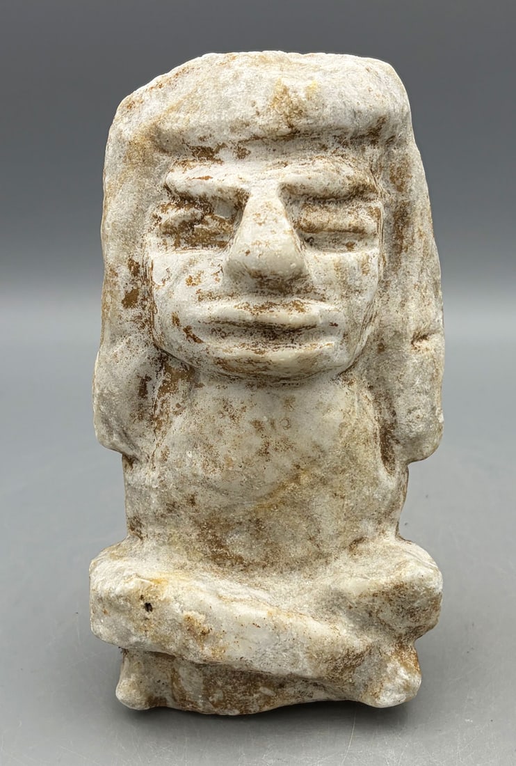 post-classic Maya stone figure - southern Mexico: A post-classic Maya stone figure from southern Mexico, ca.1000 - 1500 AD. It is 6-1/2 in. high and is carved from a white hardstone (marble?). It portrays a seated individual with legs crossed and