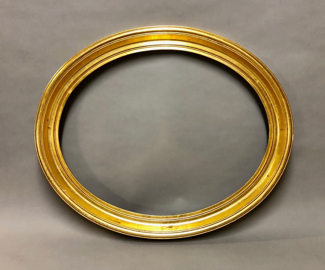 Early 20th Century Oval Carved and Gilt Wood Frame: Early 20th Century Oval Carved and Gilt Wood Frame. Rabbet Size: 16 x 20 in. Overall Framed Size: 19.5 x 23.5 in.