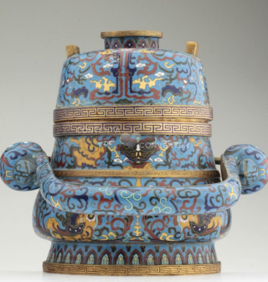 A large and heavy elegant Chinese cloisonne Hu: A large and heavy elegant lidded Chinese cloisonne Hu with handle. MEASUREMENT: H: 31 cm; W: 33 cm. CIRCA: Qing or Republic dynasty. CONDITION: Good antique condition with focal impact indent on the s