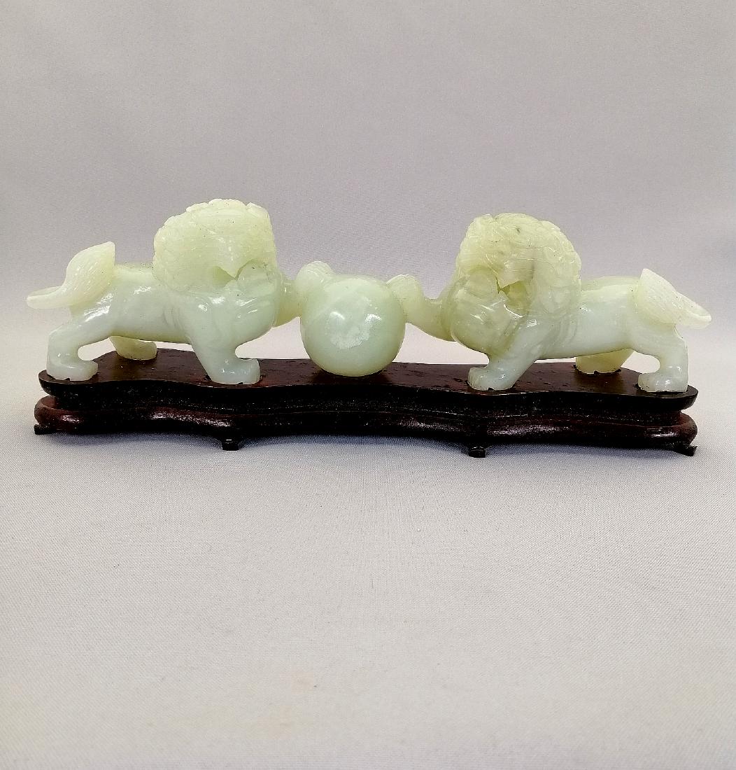 Elegant piece of jade carved lions playing a ball (1 of 11)