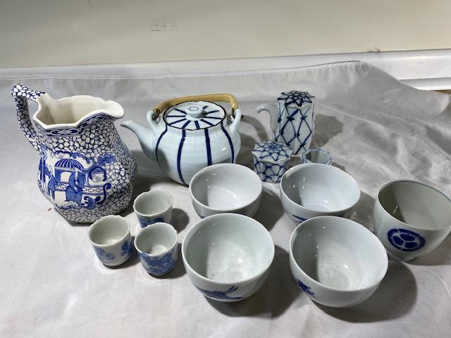 Lot of Japanese tea and soup porcelin items (13): Includes 4 Jal small bowls tea kettle, creamer container, sugar, 4 small cups for tea