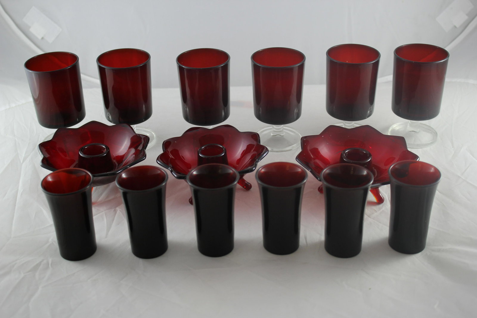 Lot of 19th C. Ruby glass: 6 ruby glass shot glasses (1880), 3 cable holders and 6 water glasses with clear base and stems