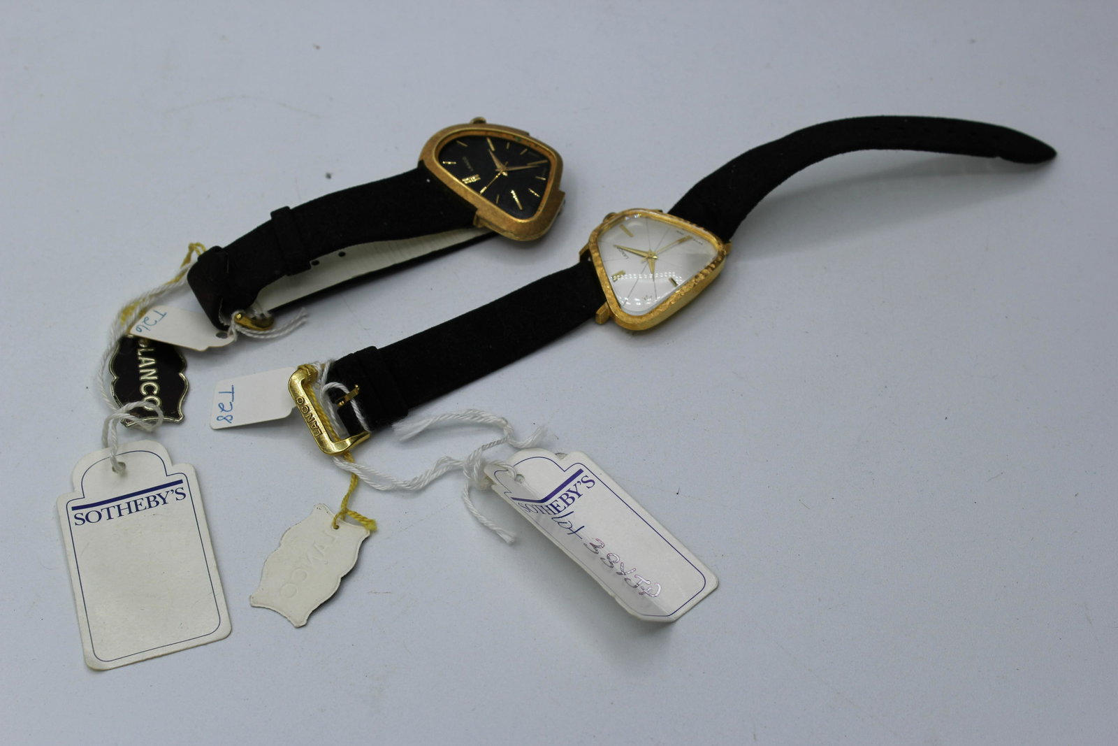 Lot of 2 Vintage Lanco Watches: Provenance: Sothebys. Lanco watches, colored gold with white background and gold with black background, Swiss made.