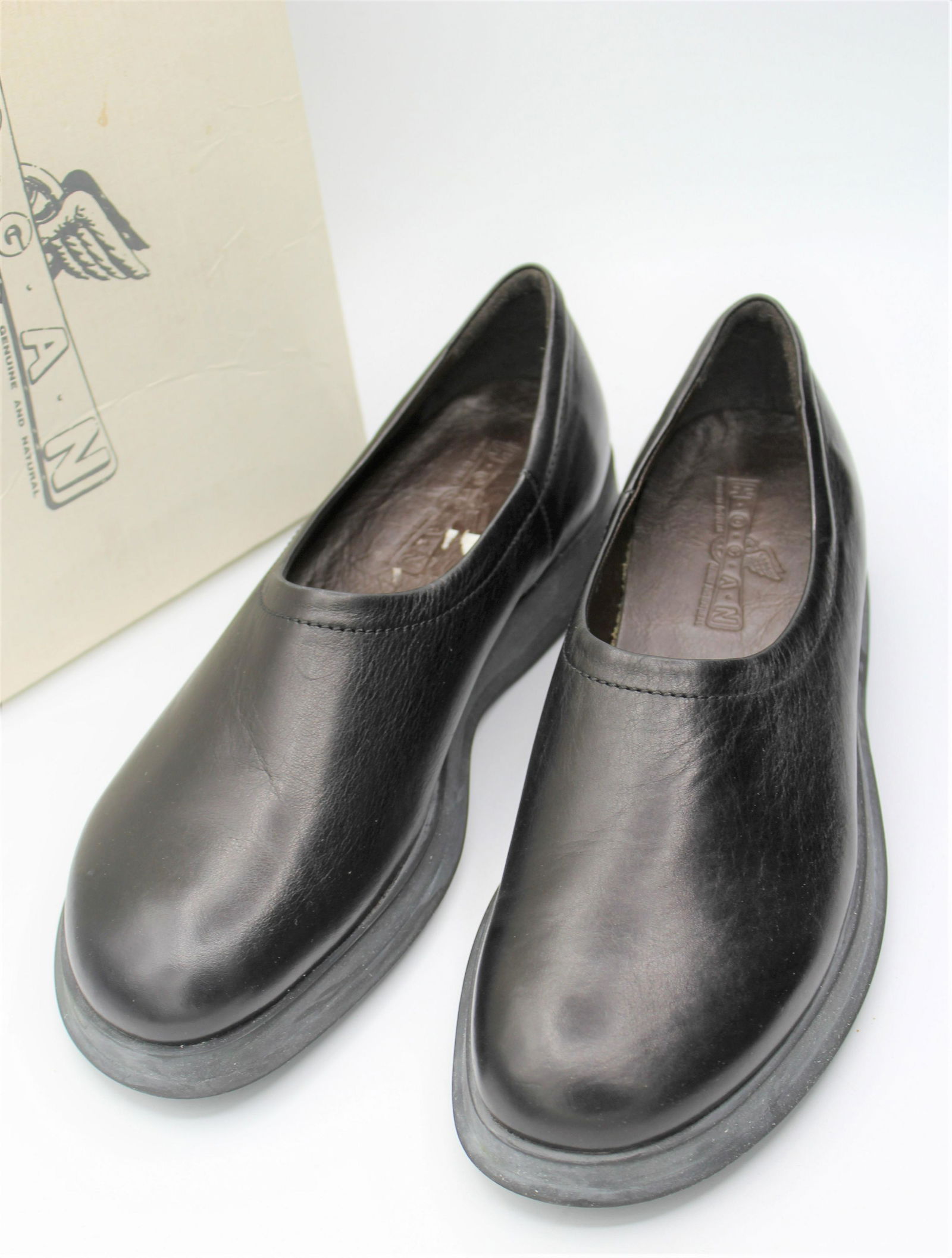Hogan Leather Slip-on Dress Shoes: Hogan all natural black leather slip on loafers with one inch sole. Made in Italy, size 9.5.