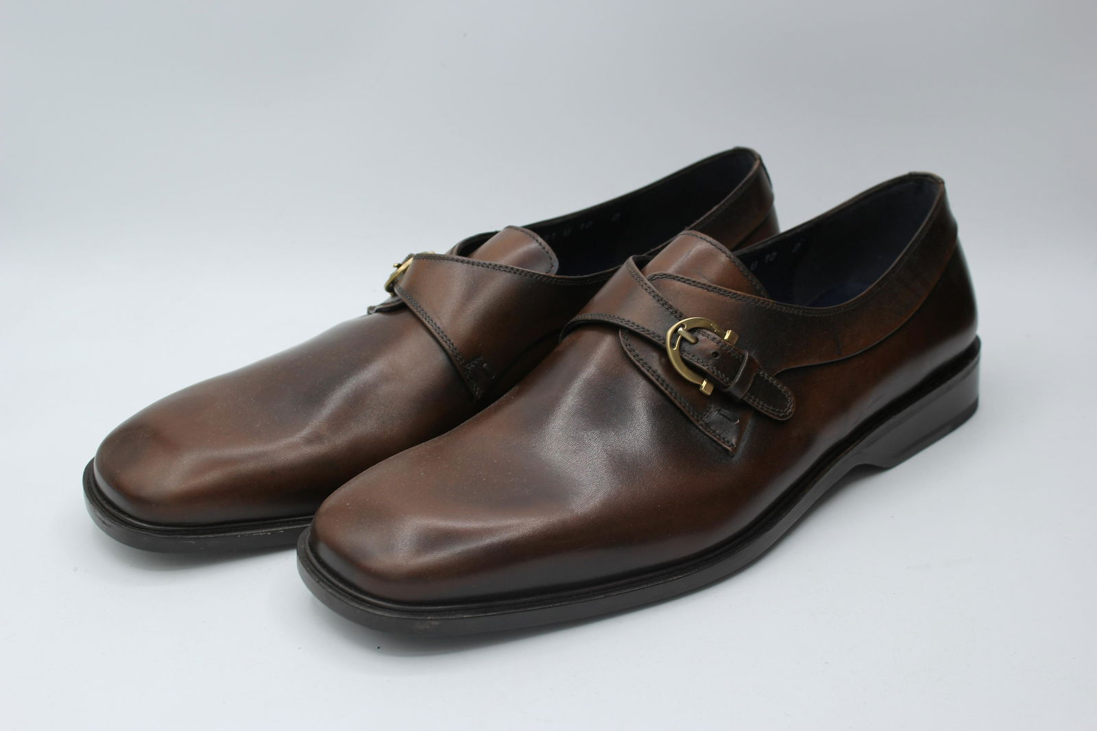 Vintage Salvatore Ferragamo Rigo Calf: Stunning dark brown leather slip ons with gold buckle. Size 10D. Made in Italy.
