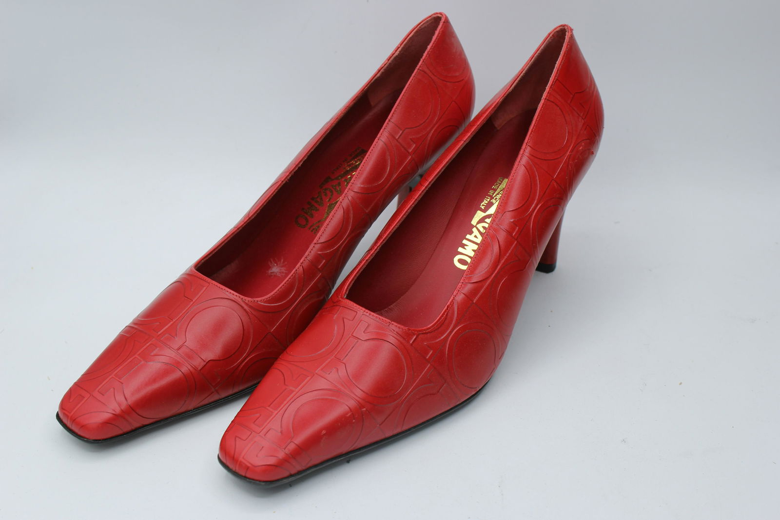 Salvatore Ferragamo Sillaba Red Pebble Calf: Striking red, 7cm high heels, size 10B. Made in Italy.