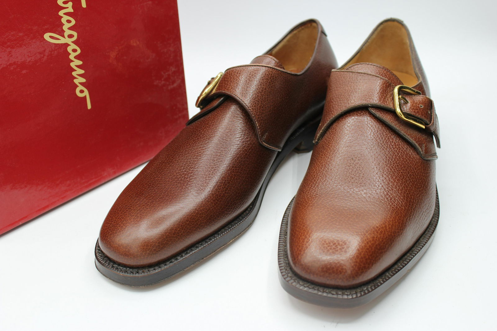 Salvatore Ferragamo Gerald Caffe: Gerald caffe-brown leather slip on with gold buckle-size 8 D.