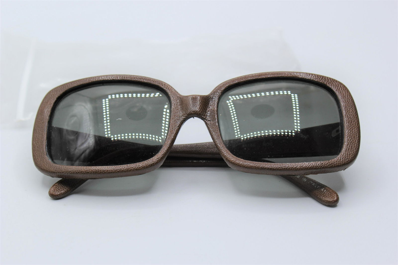 Vintage Bottega Venetta Leather Sunglasses: Leather wrapped, dark lenses.