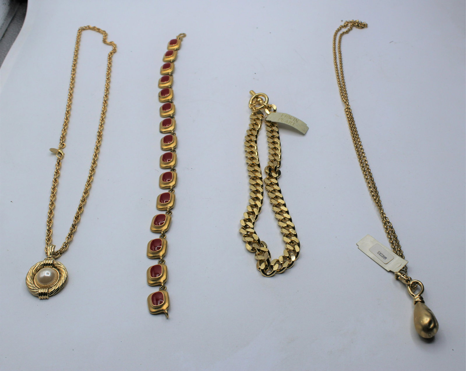 Lot of 4 Erwin Pearl Gold Tone Necklaces: Erwin Pearl established in 1952.