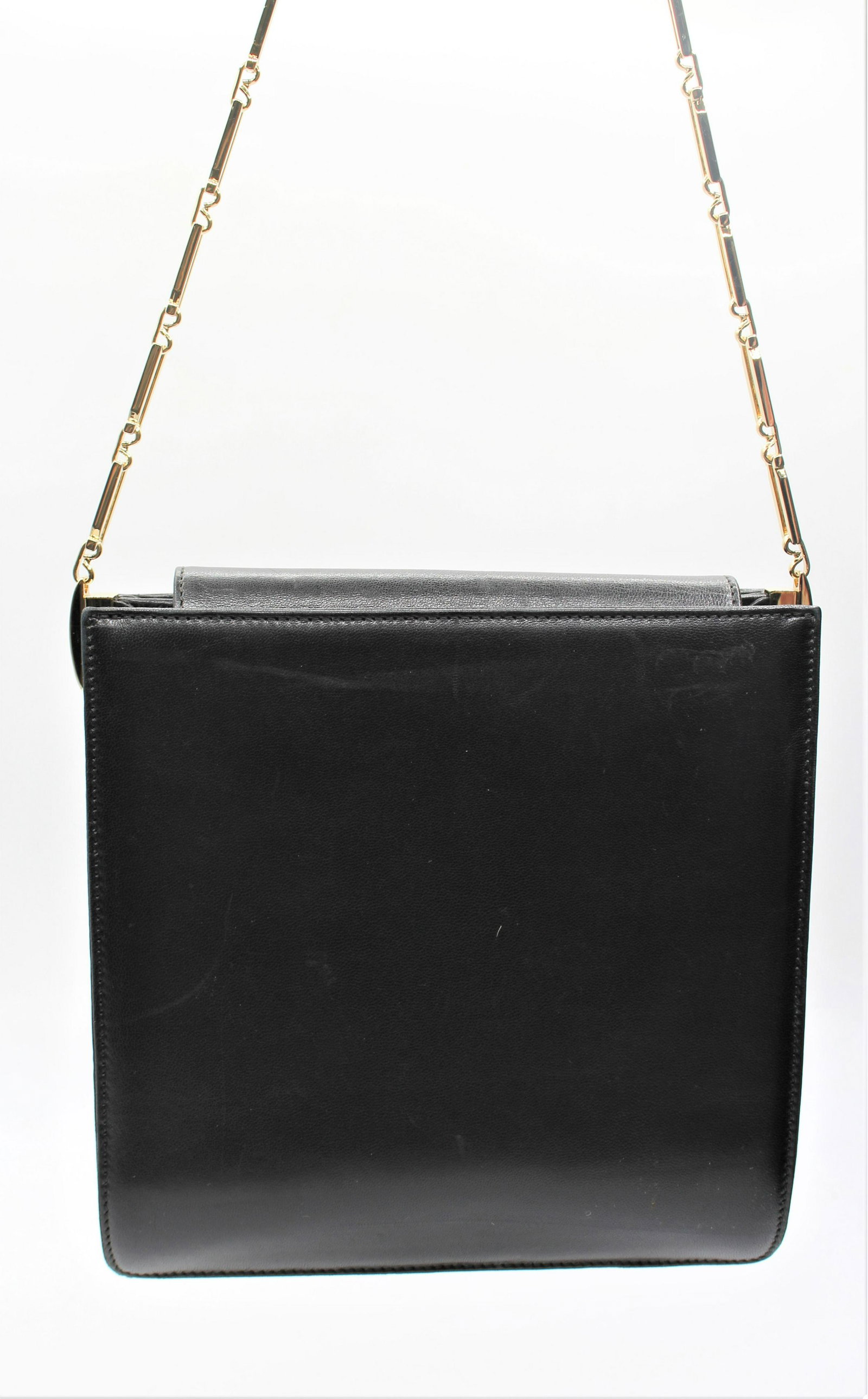 Black Ferragamo Shoulder Purse: Gold accents, metal chainlink arm strap. Two main compartments with one zipper pocket.