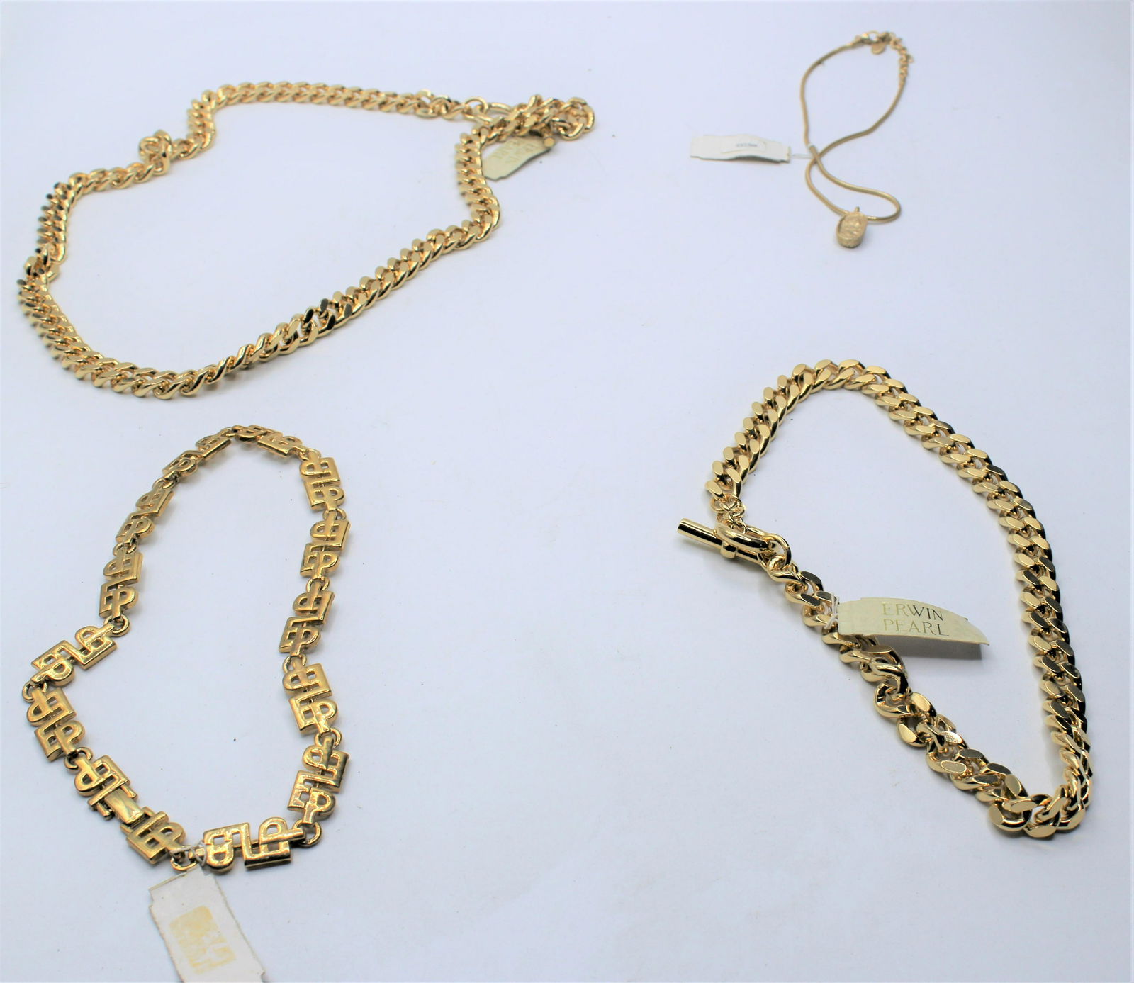 Lot of 4 Erwin Pearl Gold Tone Necklaces: Erwin Pearl established in 1952.