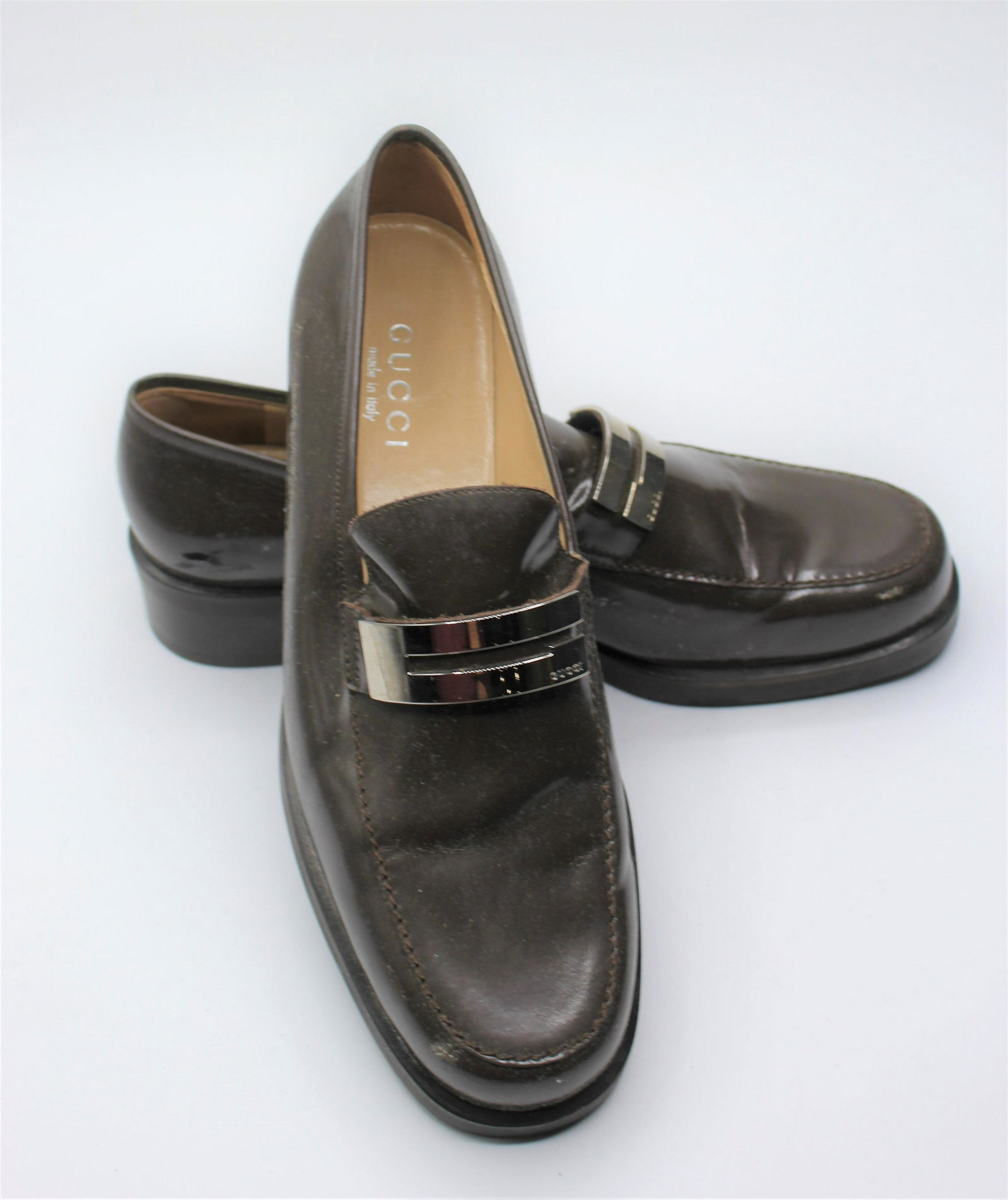 Gucci Brown Vinyl Loafers: Women's size 9.5 with silver accents.