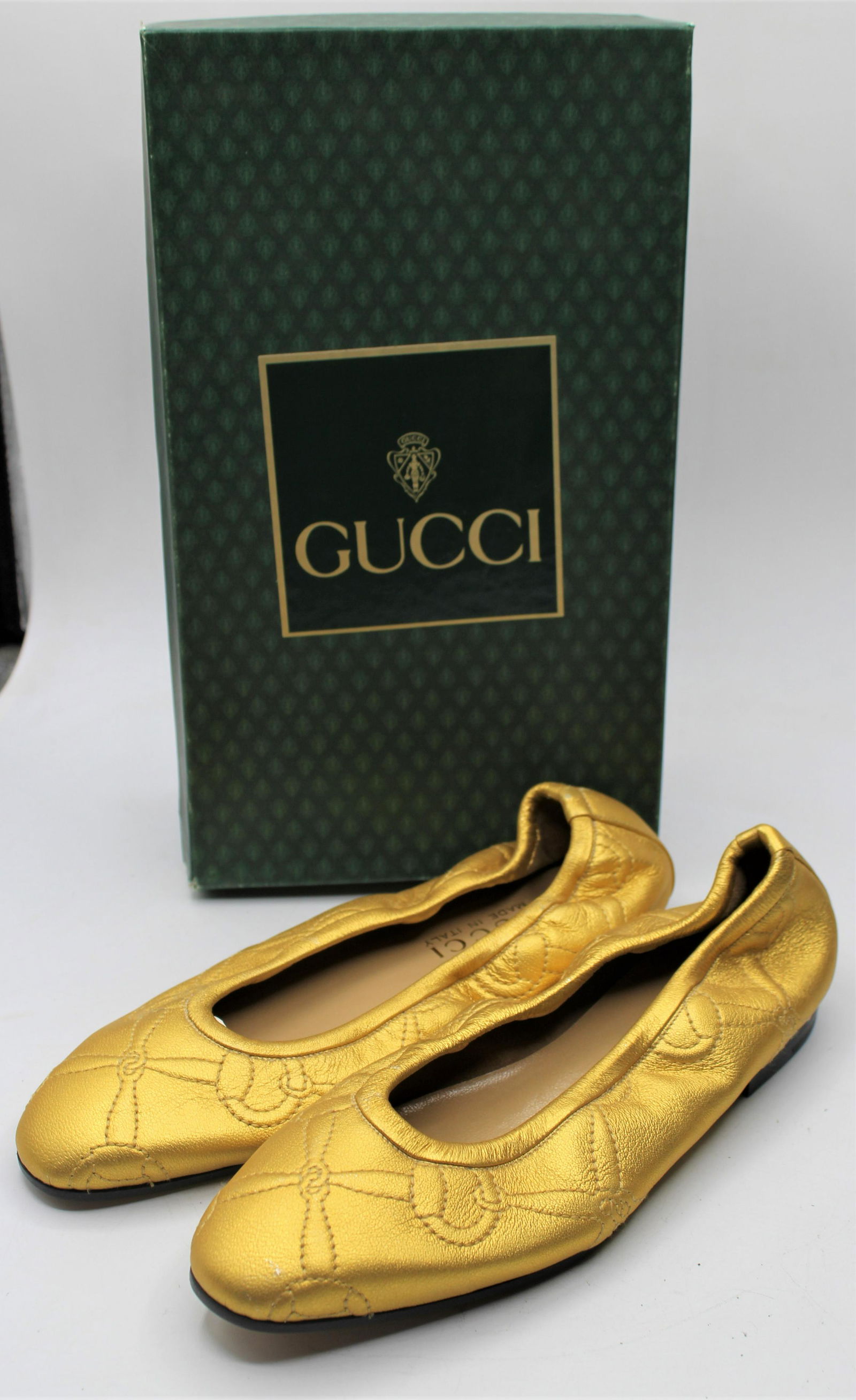 Gucci Gold Leather Flats: Gold quilted leather flats with tan interior. These shoes can be dressed up or down! Made in Italy. Size 36.