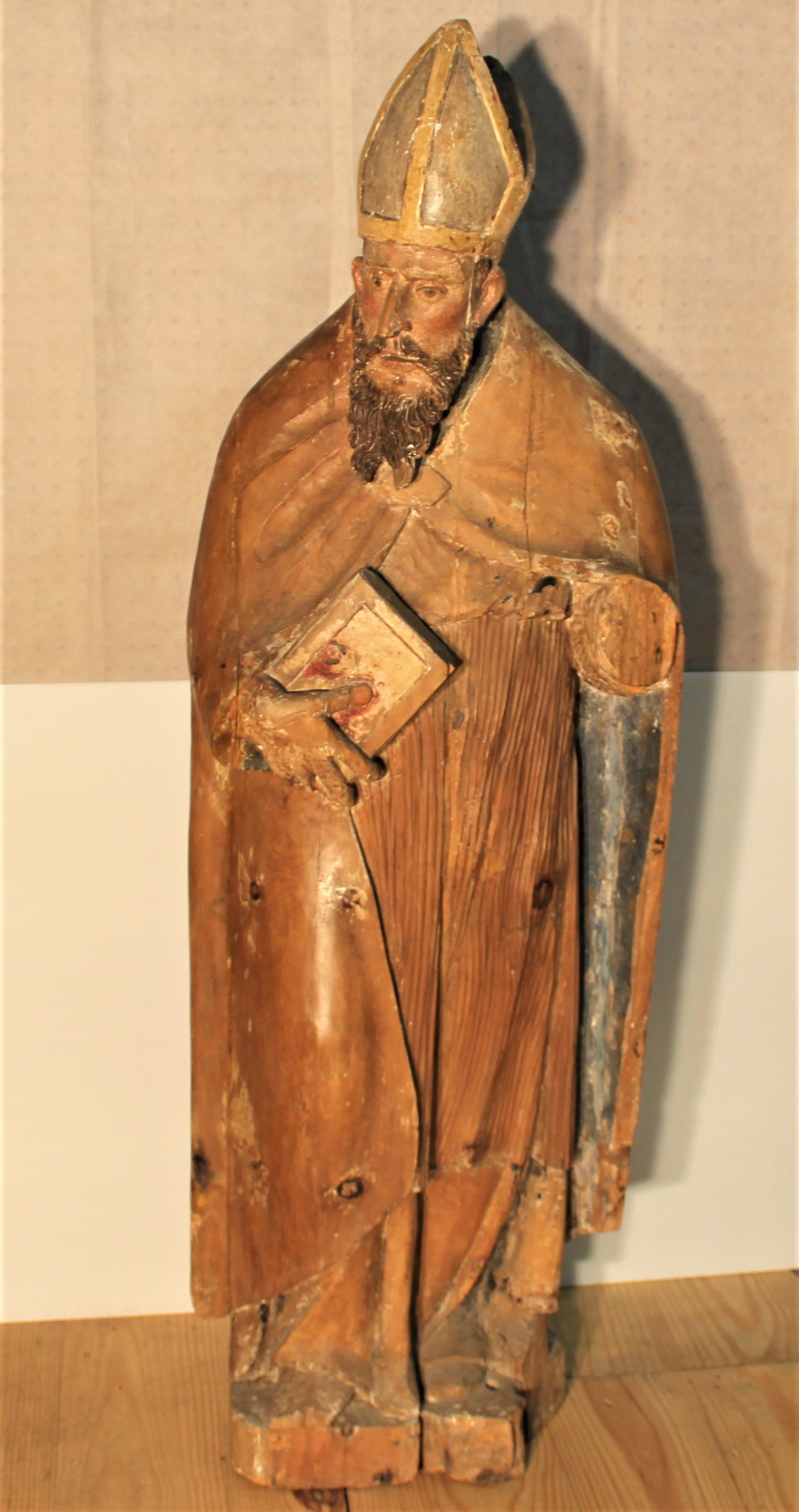 North European Baroque Carved and Painted Wood Figure: North European Baroque Carved and Painted Wood Figure of a Bishop Saint. The bearded cleric wearing cloak and robes, holding a bible. 4 ft. 7 in. x 21 in. Provenance: Stair Galleries, last sold in 201