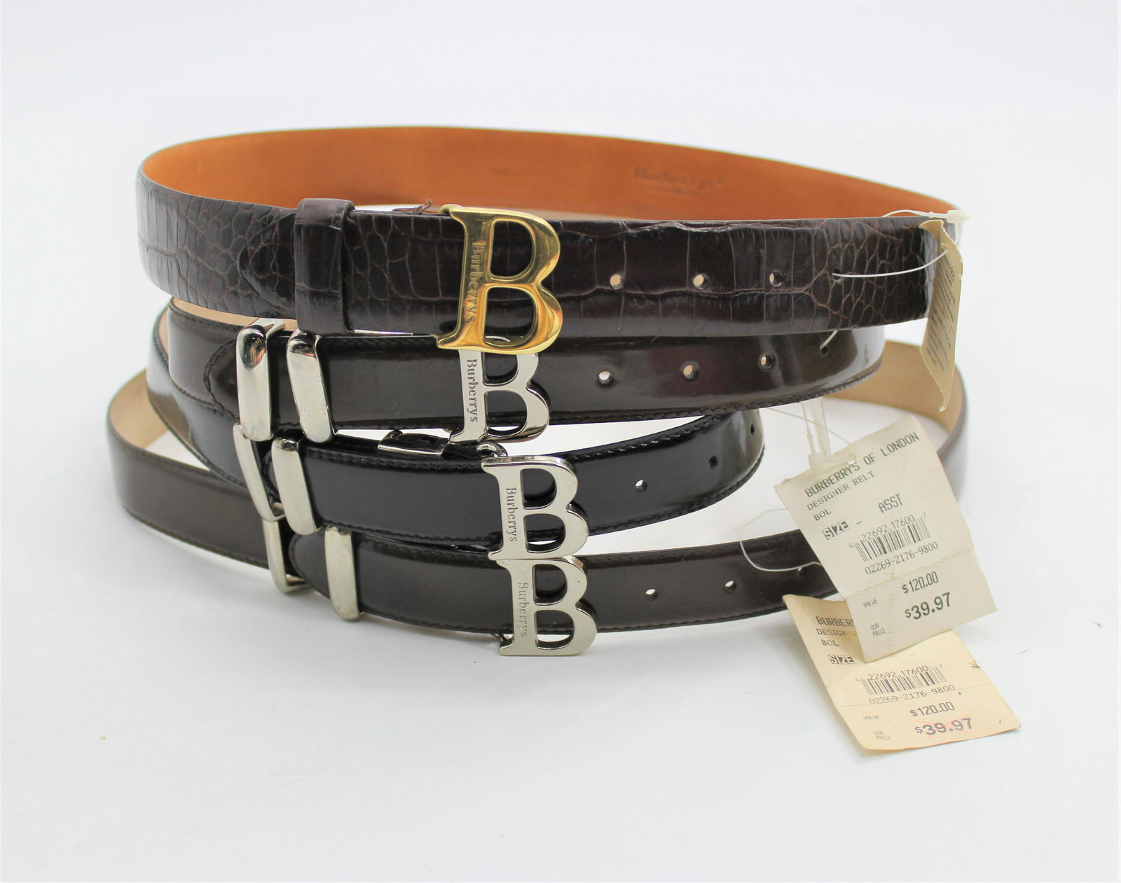 Lot of 4 Burberrys of London Belts: Lot includes 1 brown alligator pattern with gold accent (L) , 1 classic black leather (M) and 2 classic brown leather belts (M/L).