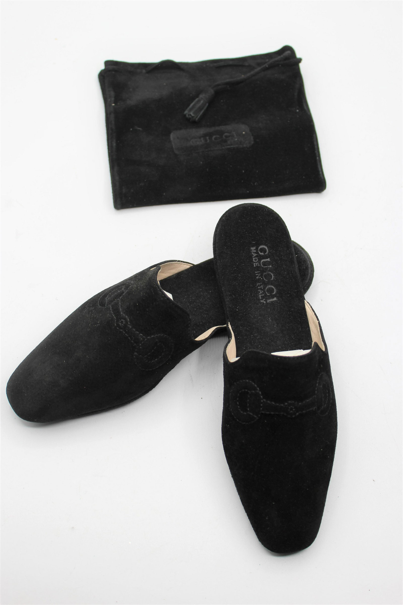 Black Gucci Women's Slides/Slippers: Soft, leather slides in black. Decorative stitching on toe. Made in Italy. Size 5.
