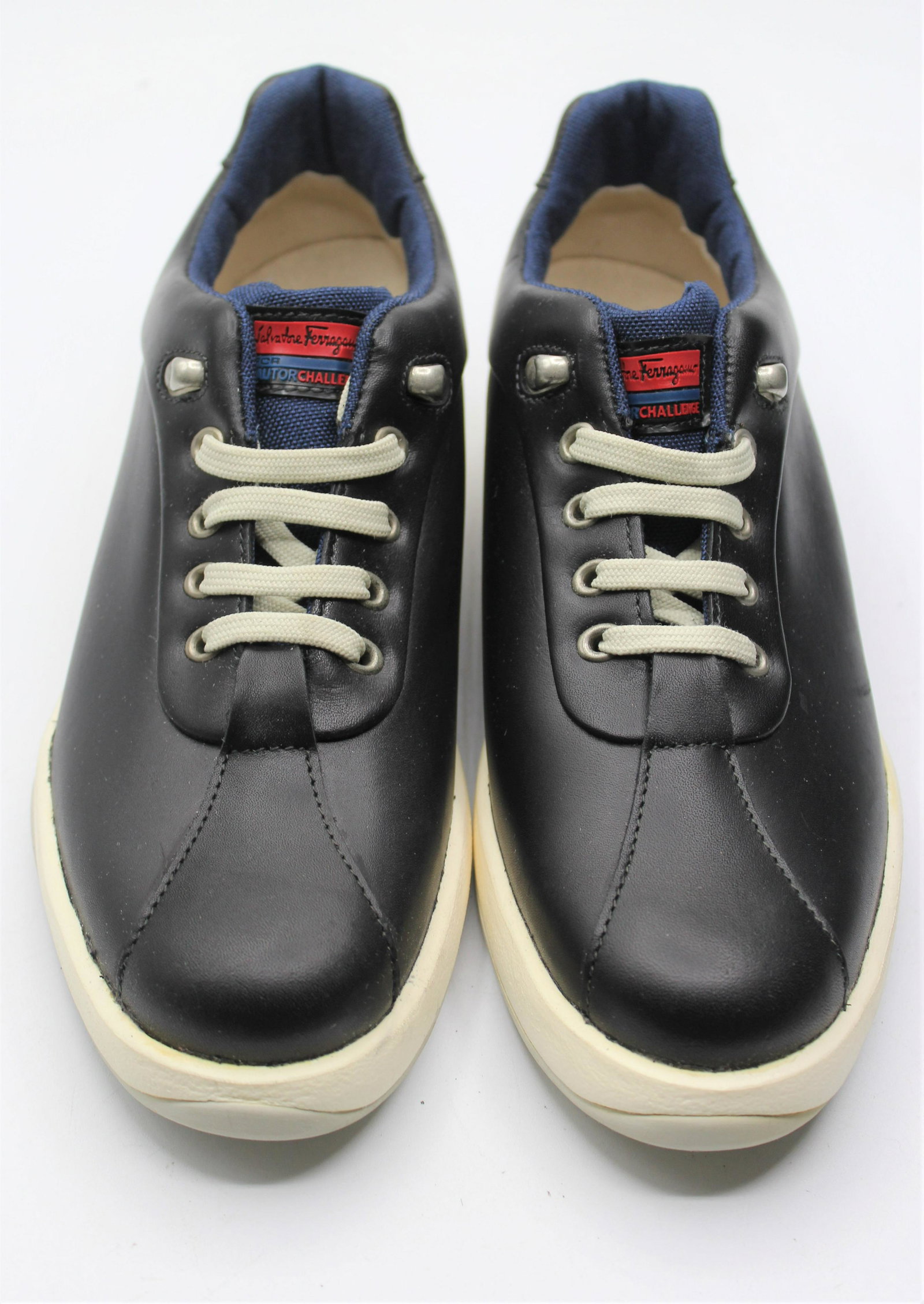 Salvatore Ferragamo Men's Sneakers: Stylish, men's leather sneakers with fabric interior. Black with navy accent. New in box. Size 9.