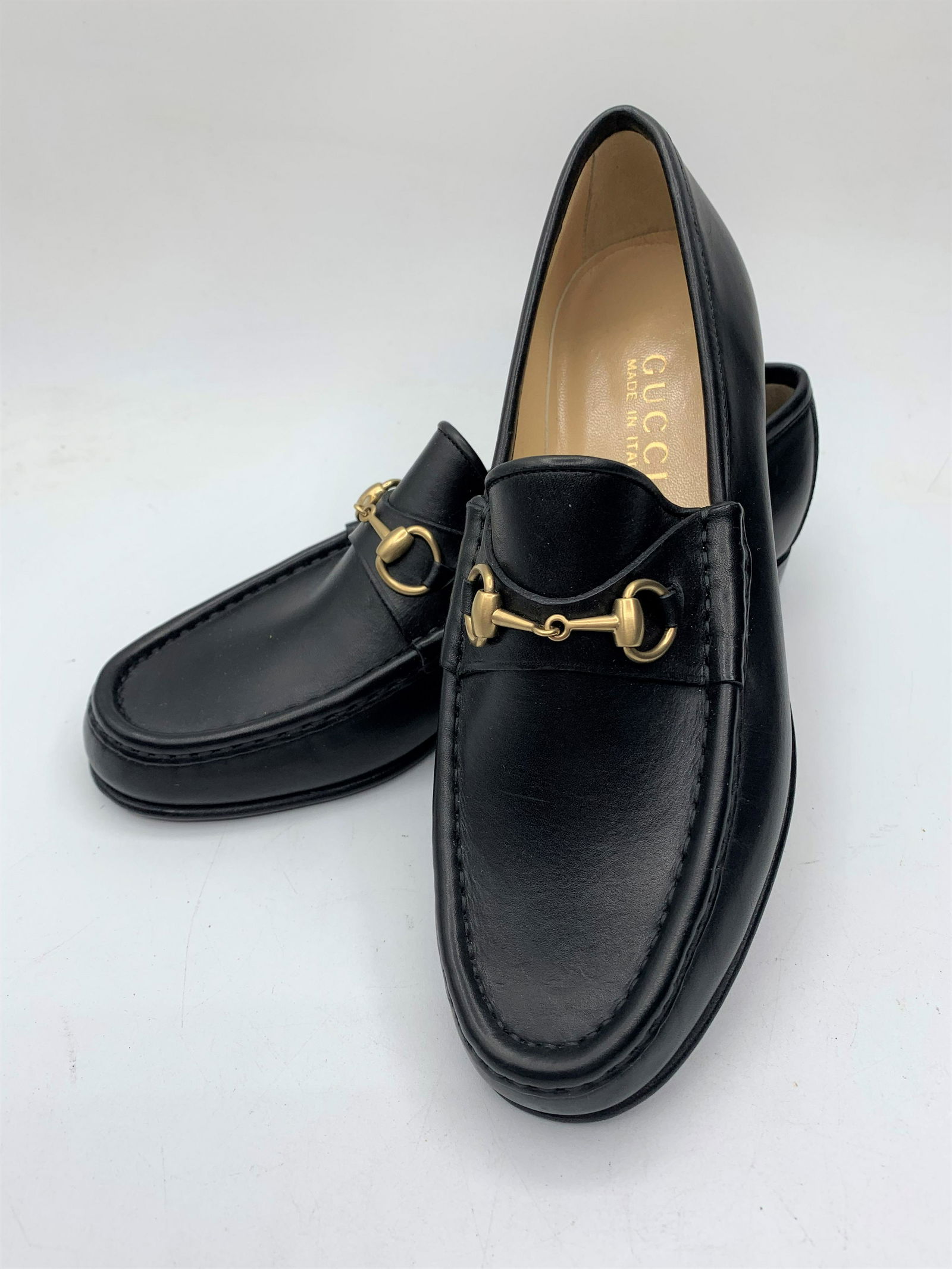 Gucci Women's Loafers: Leather Gucci Loafers in black with gold chain accent. Size 36.5, original price $295. Made in Italy.