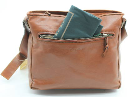 Cute Cole Haan Purse: Classic brown leather bag with one exterior pocket and silver accents. Dust jacket included.