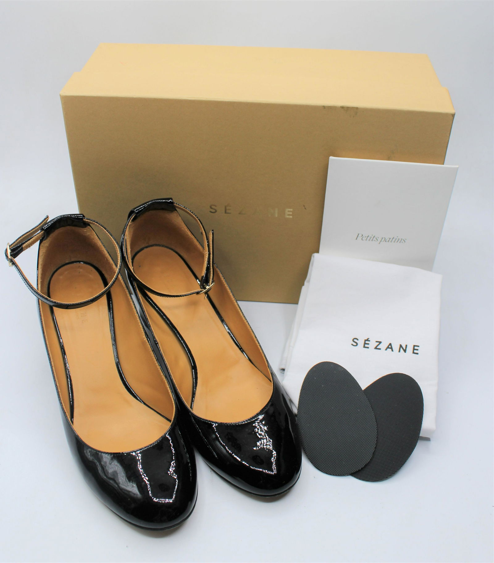 Sezane Leather Heels: Patent leather with ankle strap, and replacement sole pads. Size 37, made in Italy. Comes with box and dust jacket.
