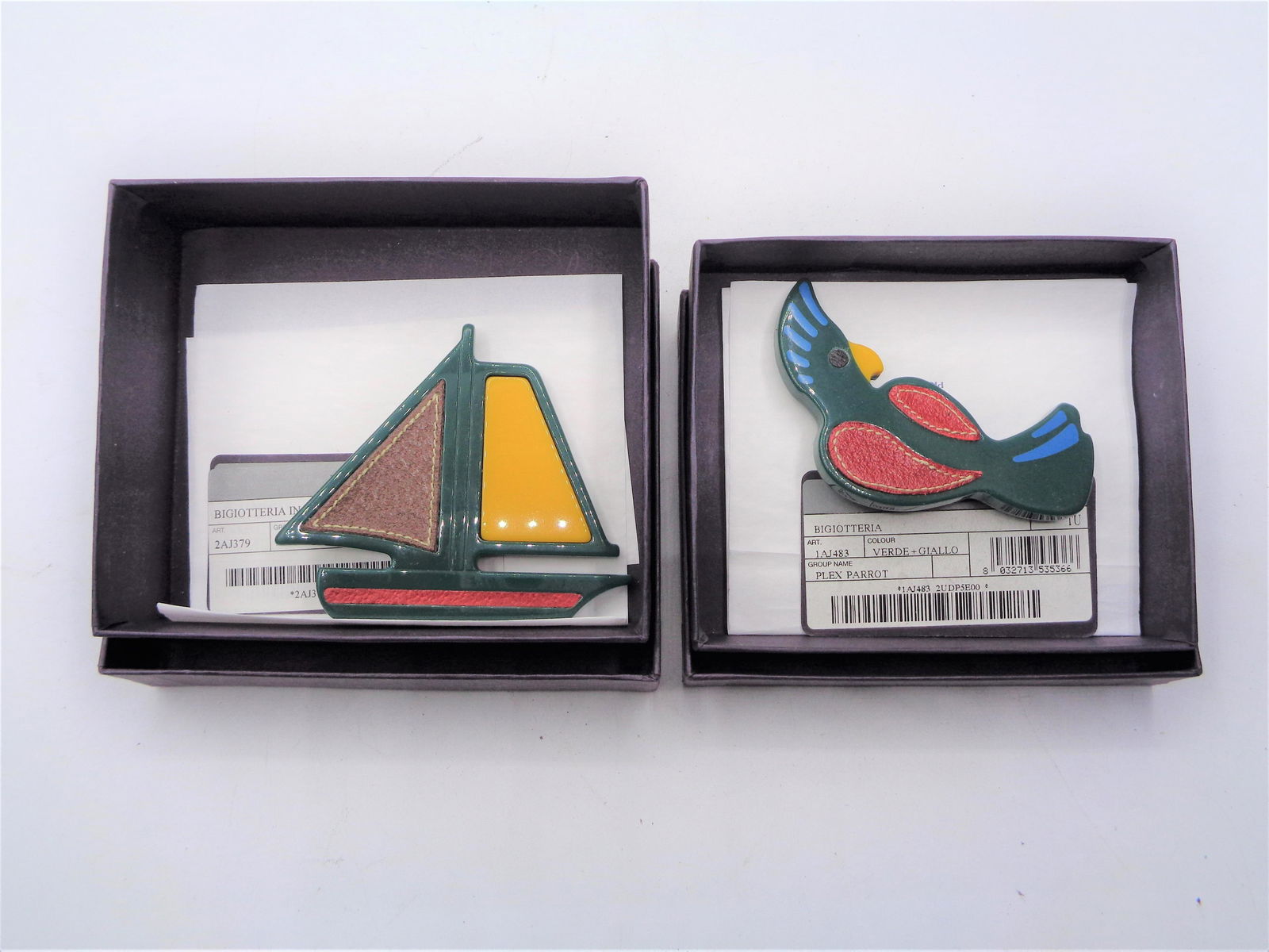 Set of Leather Prada Pins: Set of decorative Prada pins. One parrot and one boat pin included. New in box with tags. Great gift item!
