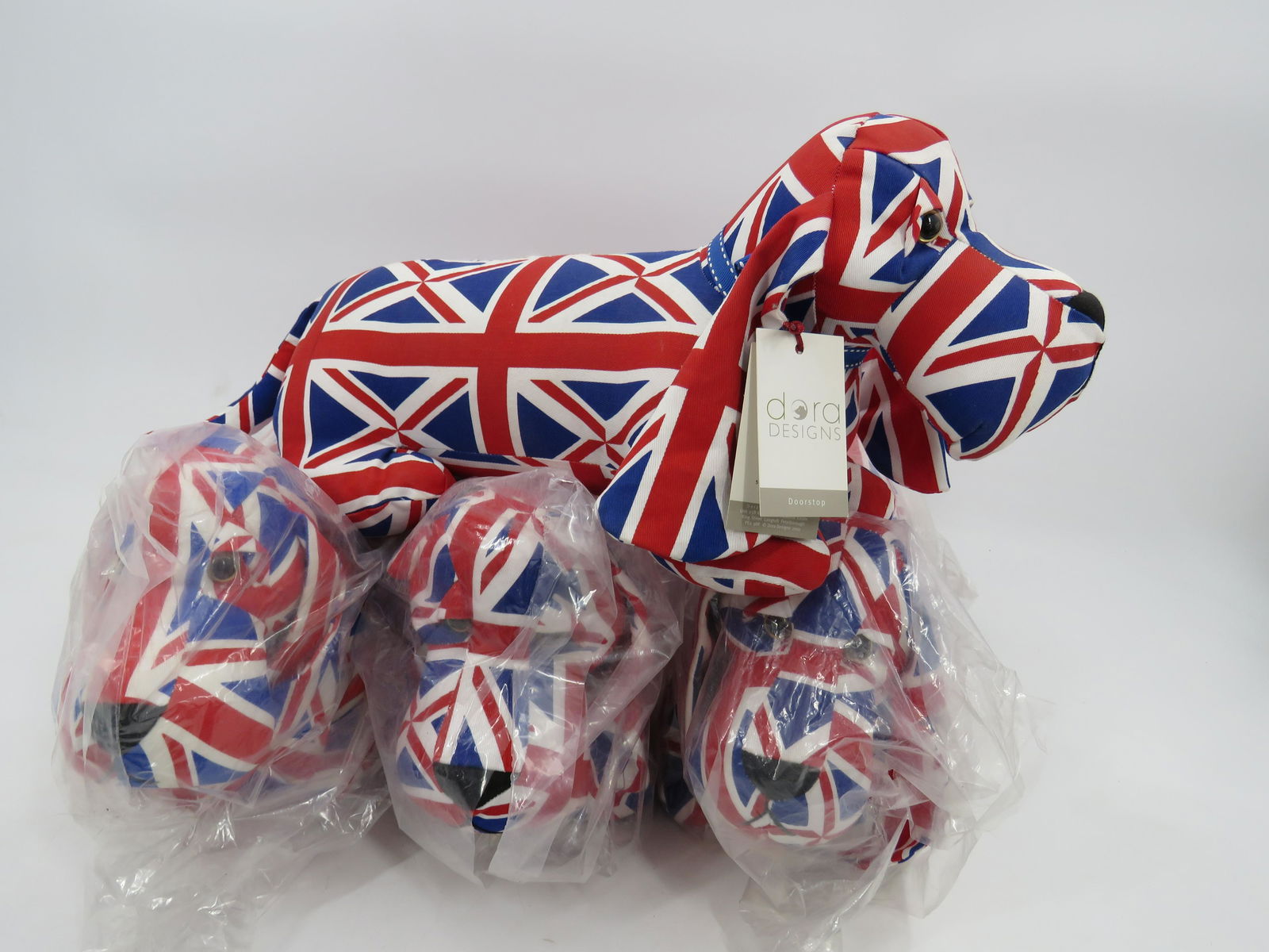 Dora Designs Doorstops: Lot of 4 Great Britain Flag, Dachshund Doorstops. Just the right weight to do the job and won't get under your feet or hurt your toes. 15"x6".