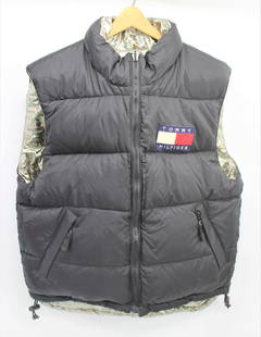 Tommy Hilfiger Reversable Down Vest: Incredibly warm, size large black vest with down stuffing! Item can be reversed to a silver metallic vest with black lining. 2 exterior button pockets on silver side and two zip pockets on black