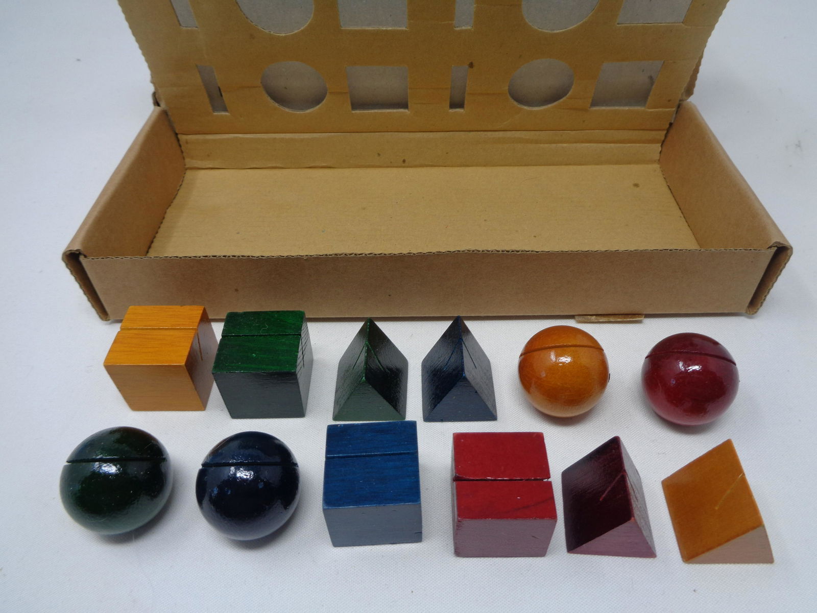 Museum Of Modern Art Place Card Holders Lot: Set of 3 "Museum of Modern Art" colored wood place card holders designed by artist Kriss Olsen ! Each box comes with 12 wooden place card holders in different colors and shapes. These are perfect for