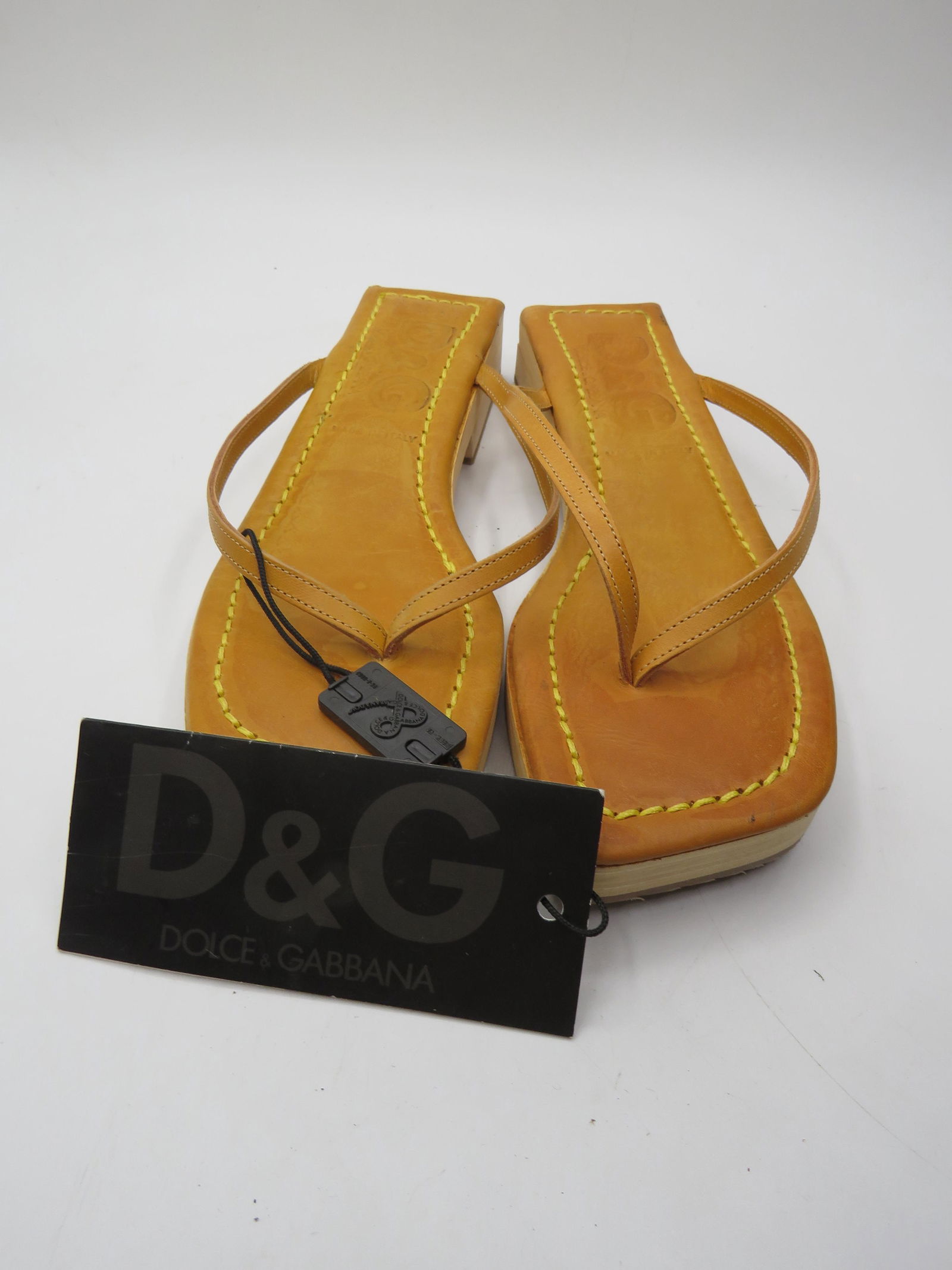 Dolce & Gabbana Tan Sandals: Tan thong sandals, size 37.