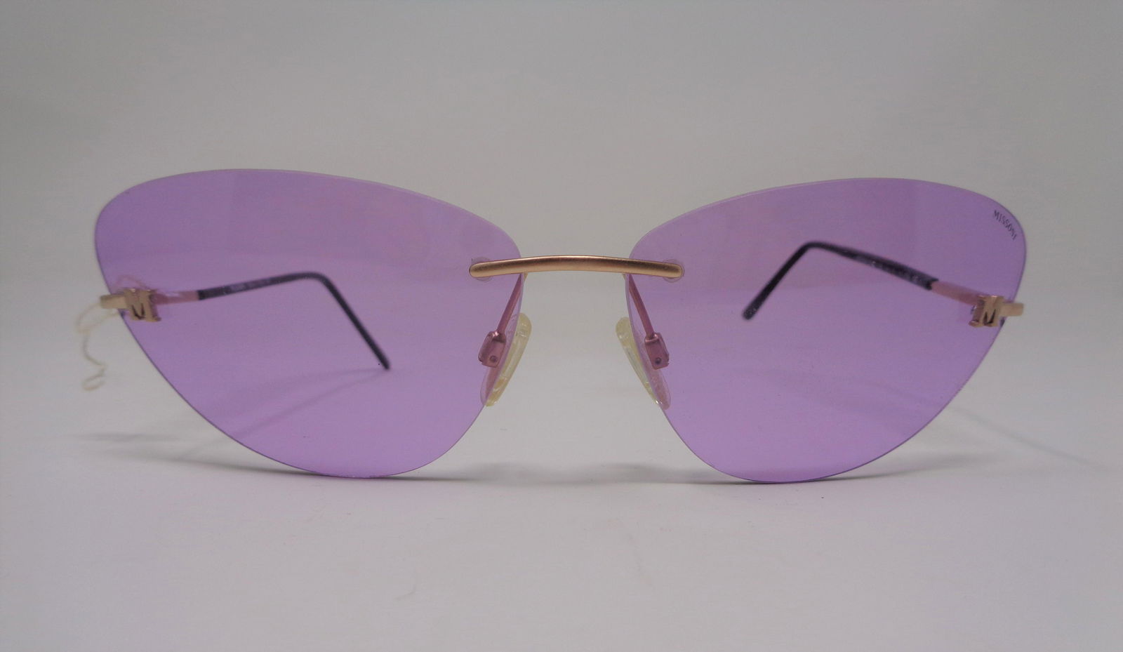 Missoni Women's Glasses: Retro Missoni women's glasses with purple tint. Body is black and gold. Decorative "M" on each glass. See photos. No cracks, scratches or chips. These are a really cool, on trend item!