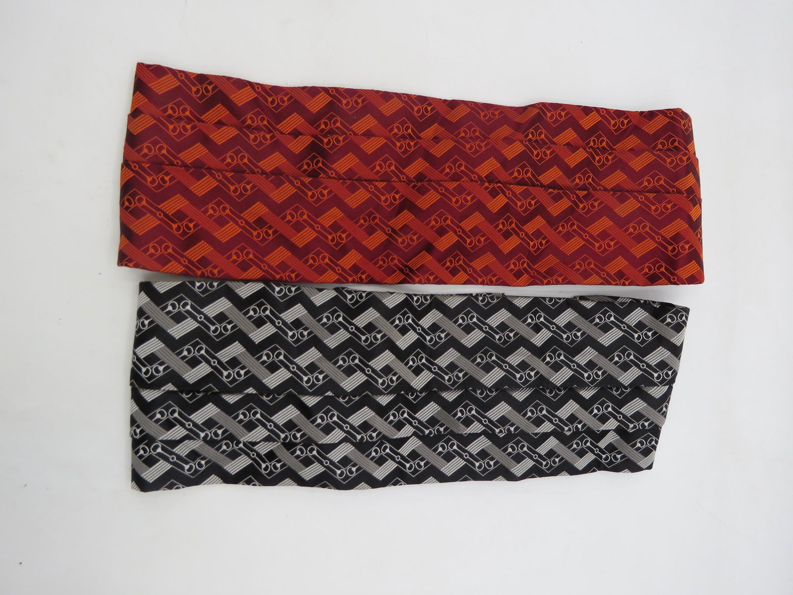 Lot of Two Gucci Cumberland Belts: Both 100% Silk. No sizes listed on tags. Both belts still have original tags. Original price $120.