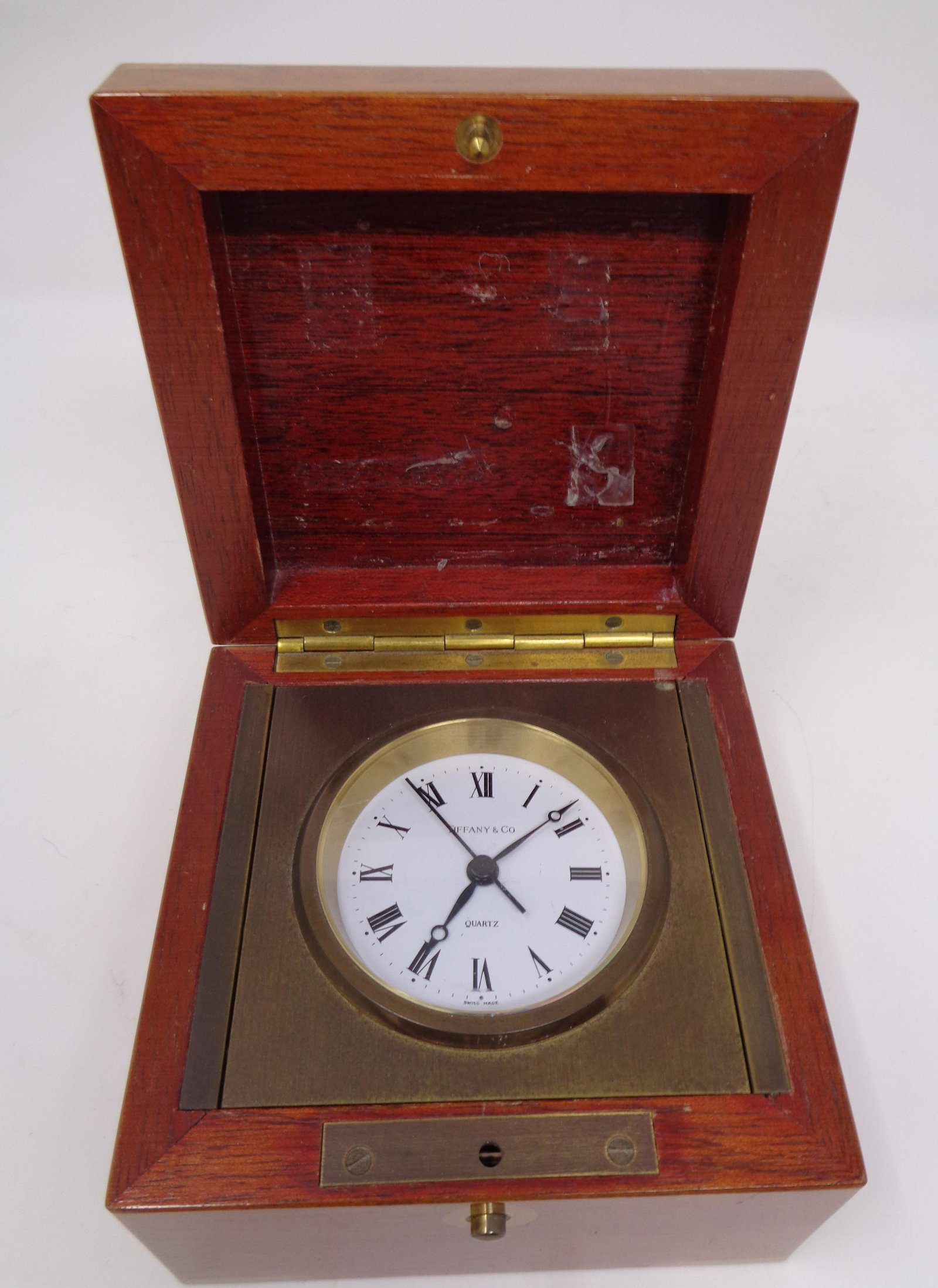 Tiffany & Co Desk Clock: What a cool piece! This item is a vintage Tiffany & Co desk clock in a box.. Item measure 4.5" inches by 4.5" inches and 3" inches tall. Push button on front to open. This is a classic piece!