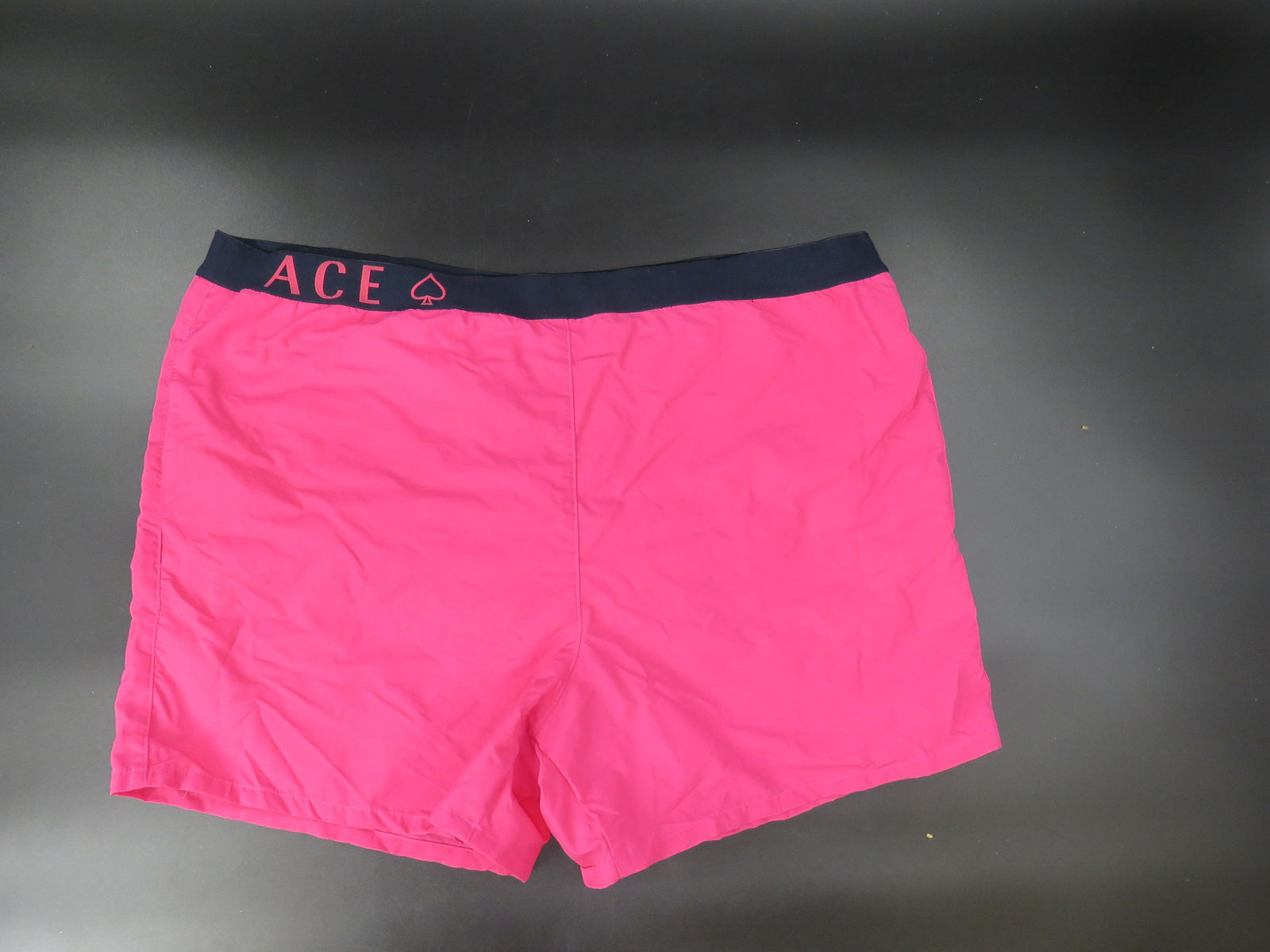 Versace Hot Pink Swim Trunks: Swim in style this summer! Hot pink, Versace swim trunks that are sure to make a statement! Men's size XL. Swimsuit has pockets and liner!