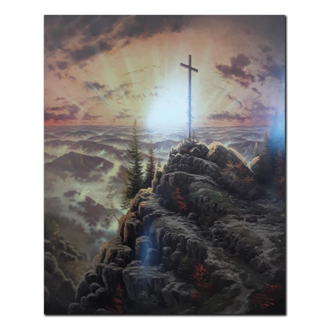 Thomas Kinkade's "Sunrise" Open Edition Print: Thomas Kinkade's "Sunrise" open edition print. This is a lovely print of a cross atop a rocky mountain, overlooking the sun on the horizon. In the very beginning of his artistic career, Thomas Kinkade