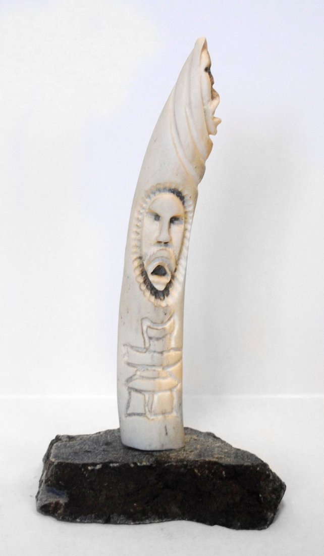 Putuguk Ashevak's "Shamen on Tusk" Sculpture: Putuguk Ashevak's "Shamen on Tusk" sculpture. Carved in 1995, from the community of Taloyoak. 6 1/2" x 5" x 10".Original Inuit sculpture, Inuit carving, Inuit art. Native sculpture, Native carving, Na