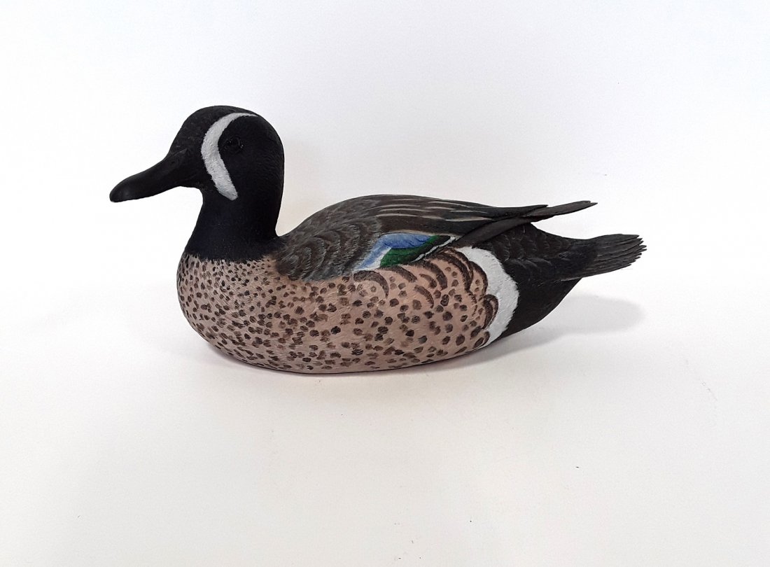Tony Bendig's Blue Winged Teal Carving: A beautifully carved blue winged teal duck. This is a masterpiece by the award winning carver Tony Bendig. The attention to detail and the quality of the paint make this a truly exquisite piece. This