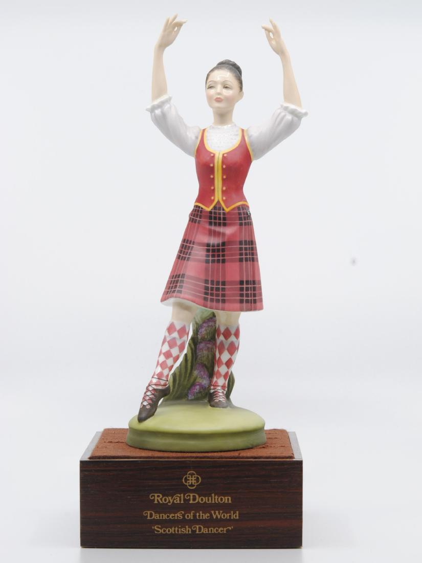Royal Doulton "Scottish Dancer" L.E. Figurine 2436: Royal Doulton "Scottish Dancer" figurine. This is from the "Dancers of the World" collection. Figurine of a Scottish woman wearing a red and black skirt, and a red and yellow vest. H.N. 2436. Limited 