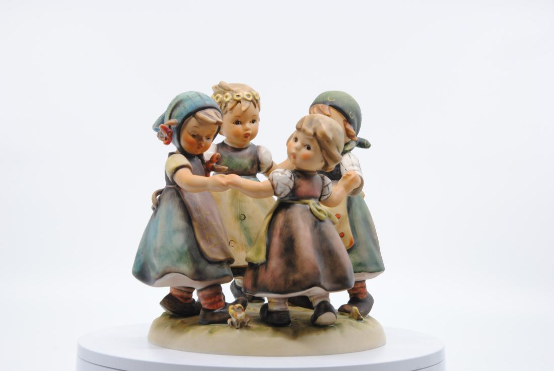 Goebel Hummel "Ring Around the Rosie" Figurine 348 TMK5: Goebel Hummel "Ring Around the Rosie" figurine. Figurine of four young children holding hands in a circle. With the Goebel W. Germany trademark on the bottom. This piece is in great condition with som