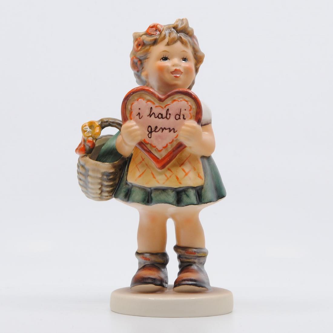 Goebel "I Like You" Collector Figurine 387 TMK-5: Goebel "I Like You" figurine. This is a figurine of a little girl holding a heart in her hands, with "i hab di gern", written on it. This piece is in pristine condition with no signs of damage, wear, 