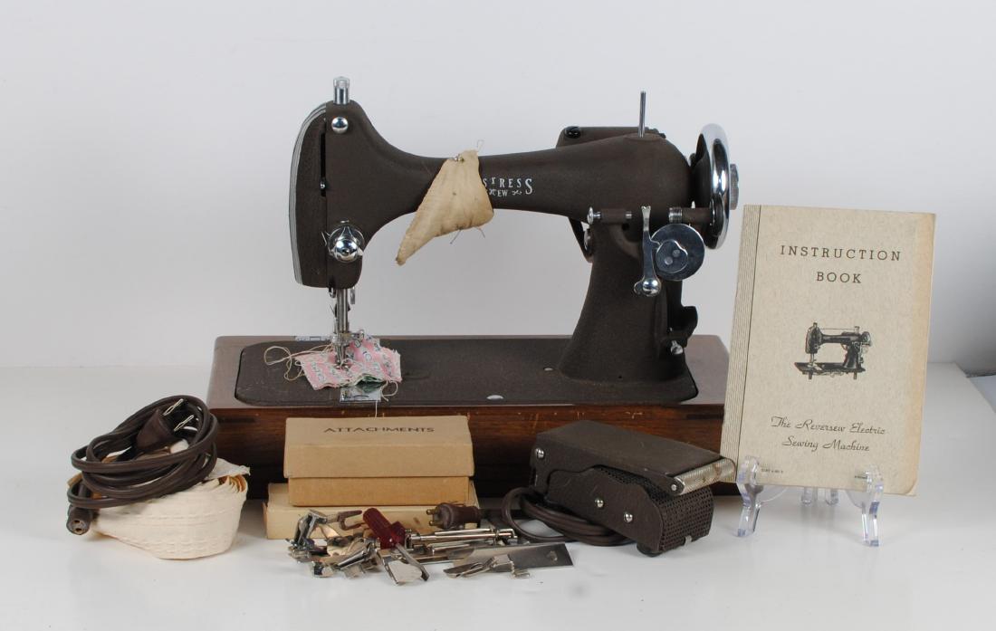 Vintage "National" Sewing Machine Made in USA: A vintage "National" sewing machine, by the National Sewing Machine Co. Made in Belvidere, Illinois. Included with the foot pedal, all the attachments, the instruction book, and a carrying box. The se