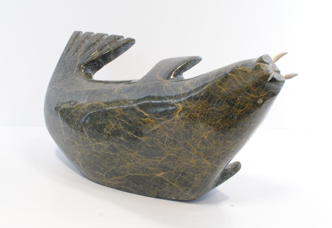 Peter Animiuq's "Walrus" Original Inuit Carving: Peter Animiuq's "Walrus" original Inuit carving. Carved fom stone, and certified by the government of Canada. This carving is in excellent condition. Included with its certification tag.