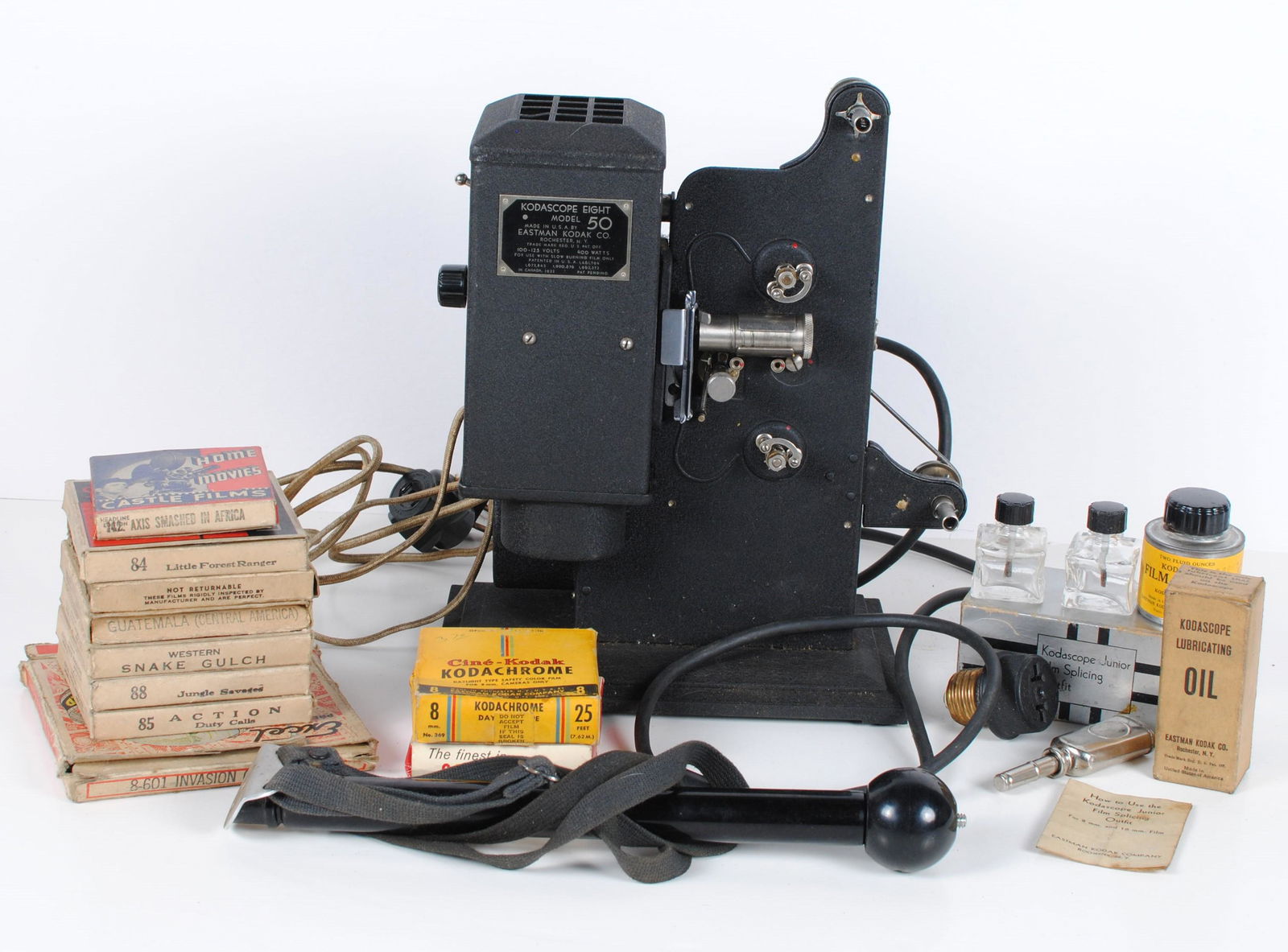Kodascope Eight Model 50 Vintage Film Projector: Kodascope Eight Model 50 vintage film projector. Made in U.S.A. By Eastman Kodak Co. in Rochester, New York. Many 8mm movies, with titles including 'Guatamela (Central America)', 'Western Snake Gulch'