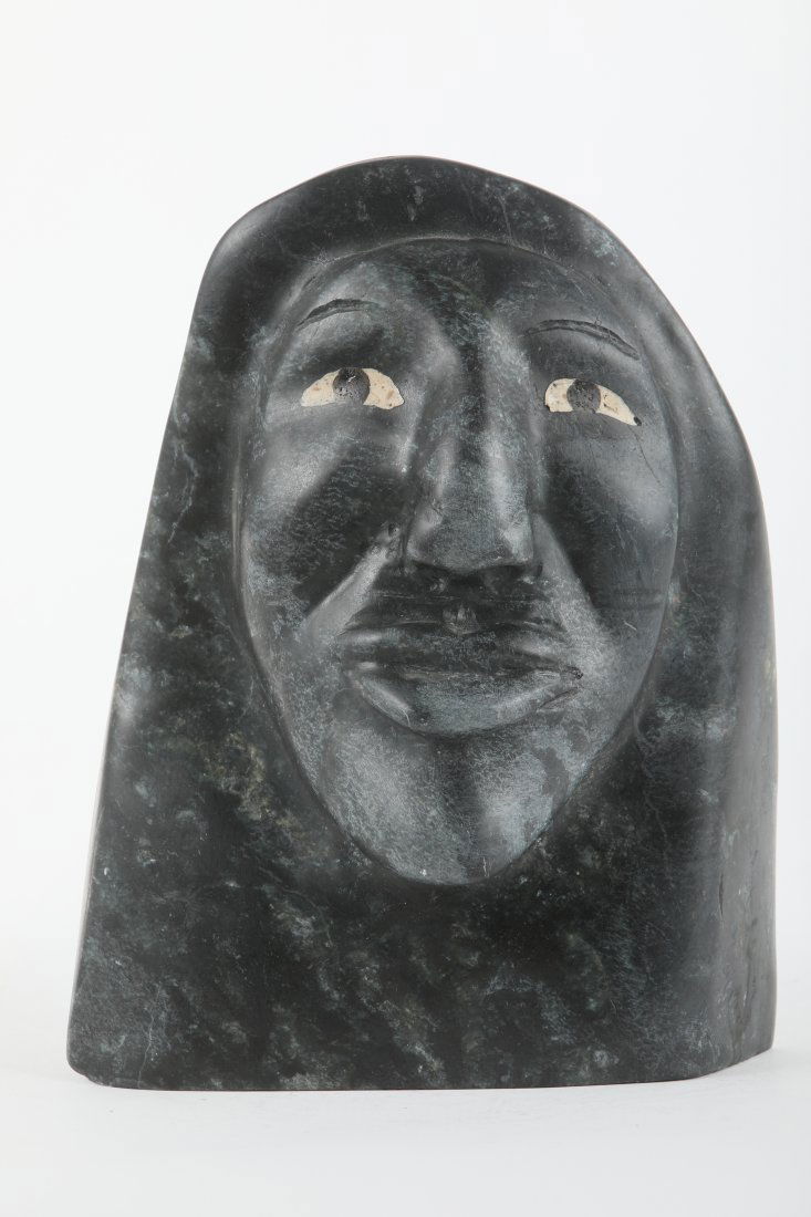 Tony Ittunga's "Inuk Face" Original Inuit Sculpture: Tony Ittunga's "Inuk Face" original Inuit sculpture. Carved from stone in 1992 from the community of Taloyoak. Included with its certificate of authenticity from the Government of Canada. Retail price