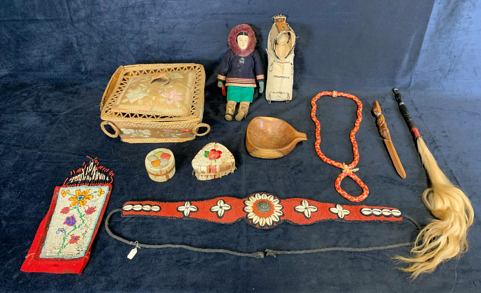 Collection of Original Aboriginal Artisan Pieces: A collection of 11 original Aboriginal artisan pieces. Included is 1- ceremonial basket made of birch bark and fine root dyed porcupine quill, 2- small artisan boxes, 2- hand carved wooden people, wit